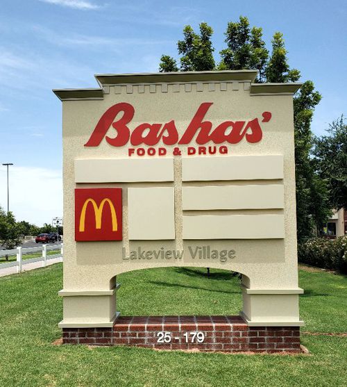 A Bashas Monument with a MacD sign board