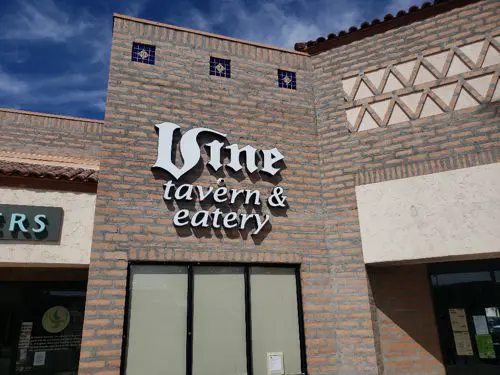 vine tavern and eatery written on a brick wall
